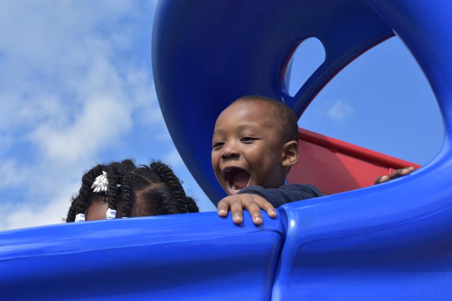 Young boy on slide